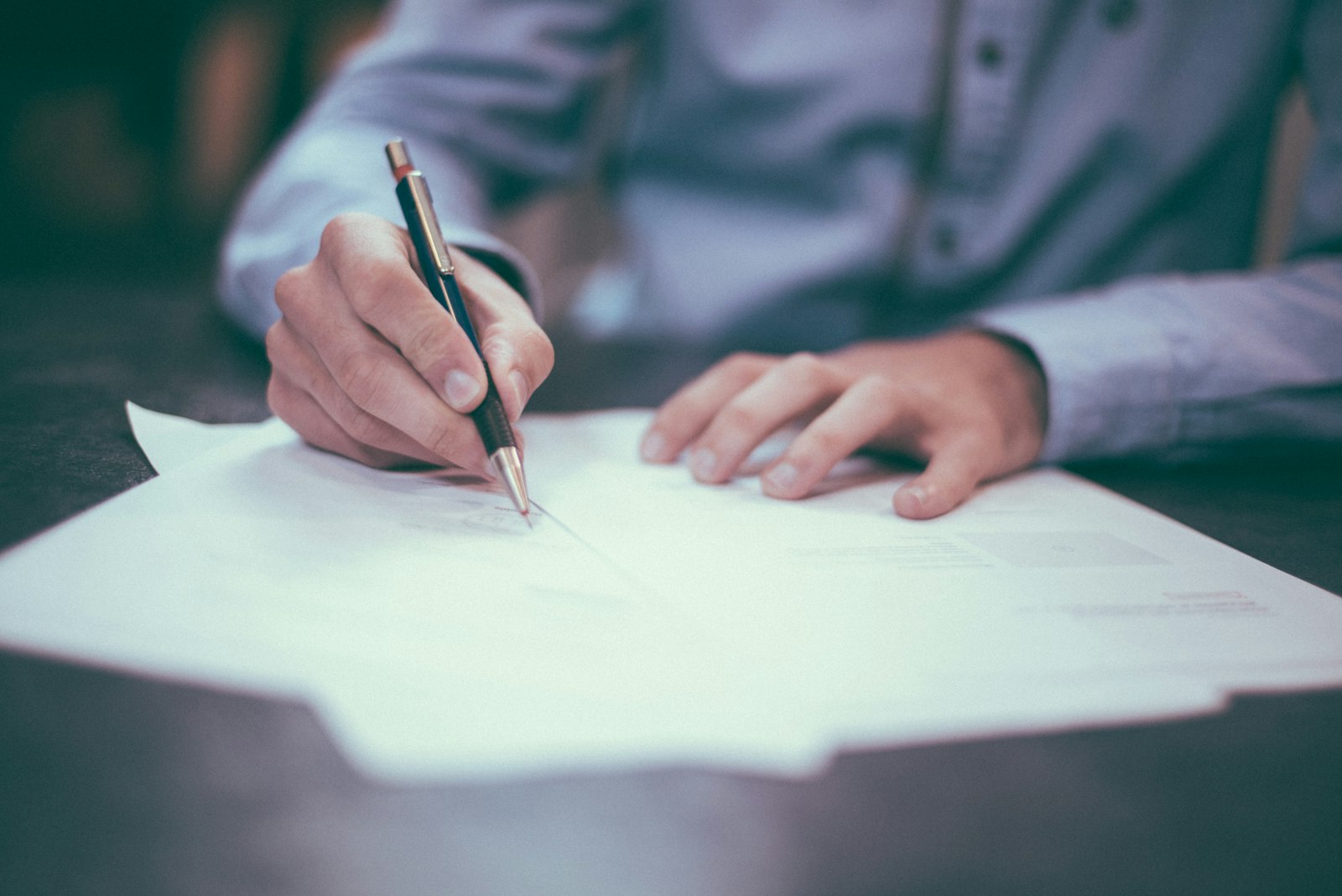 Professional reviewing business documents